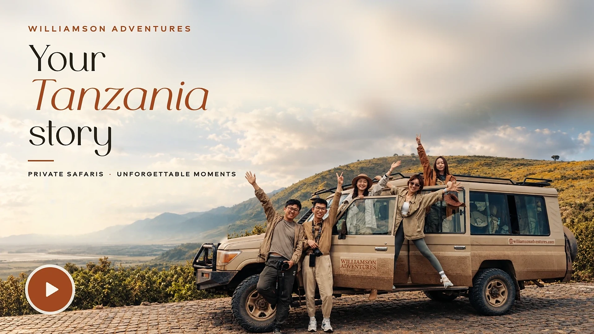 Williamson Adventures guests on a safari vehicle at an overlook above the Tanzanian plains