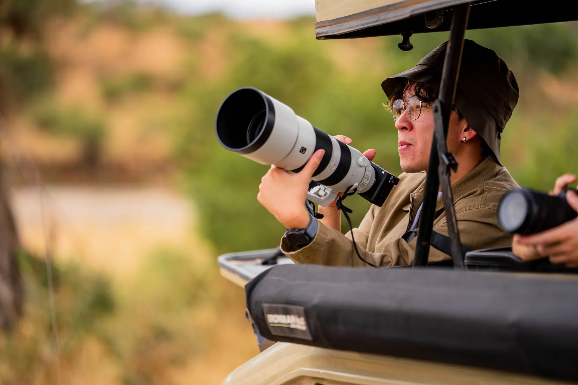 Guest photographing wildlife with a telephoto lens