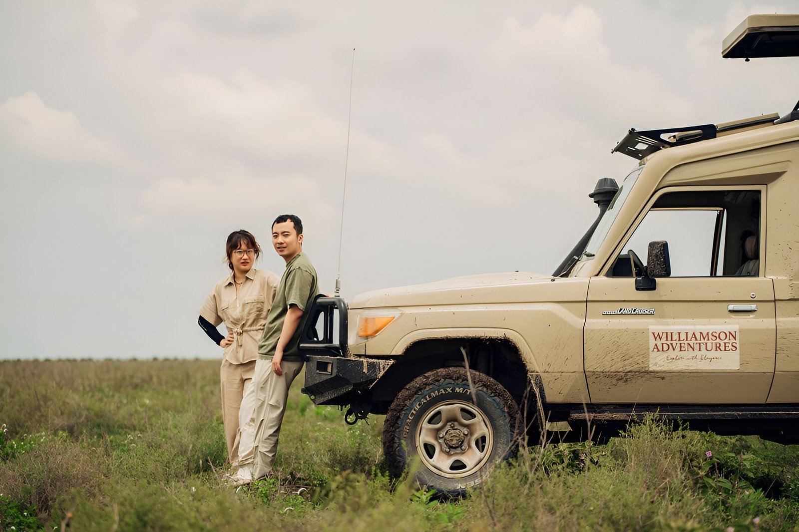 Williamson Adventures guests beside their private safari vehicle in Tanzania